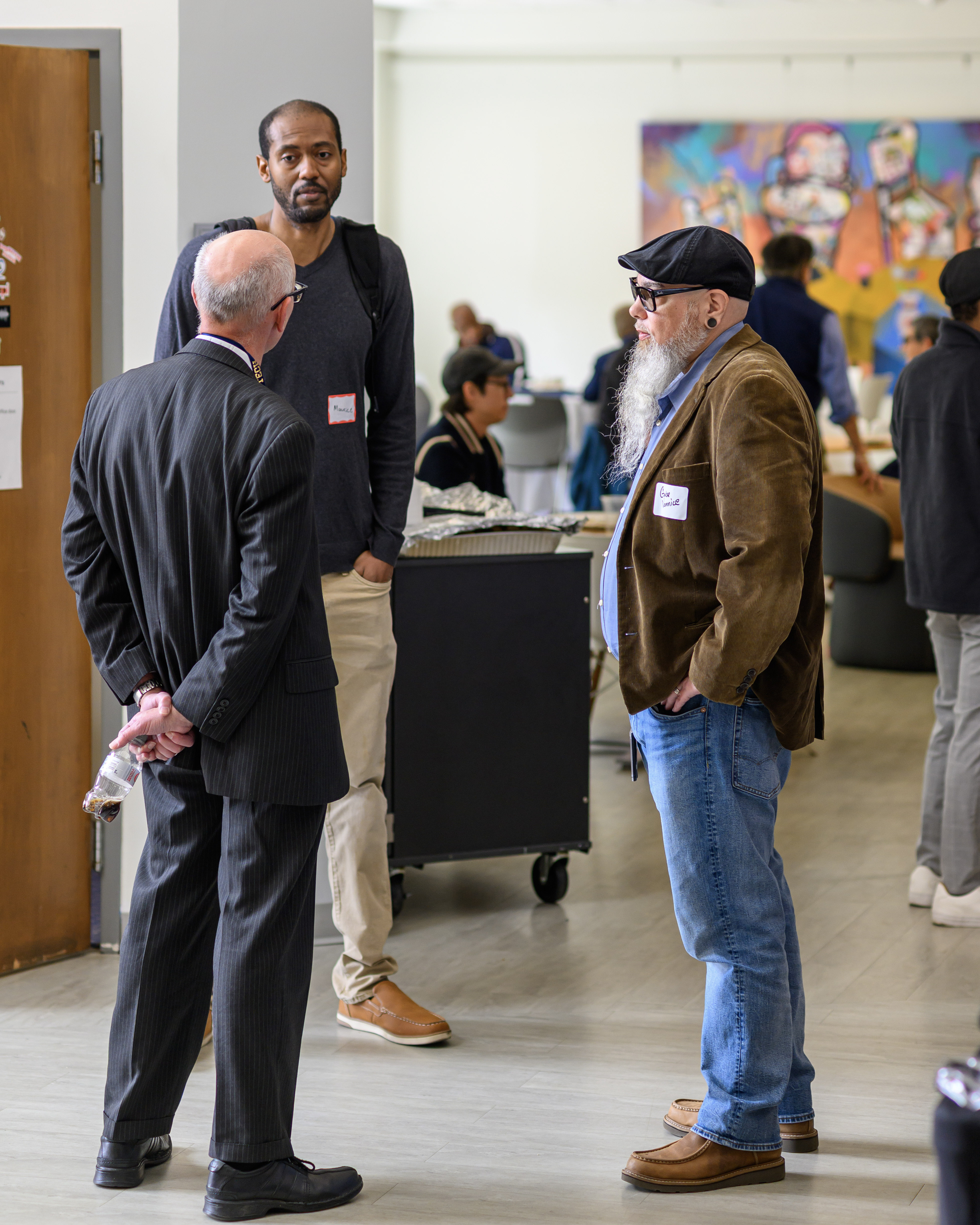 Symposium attendees talk during an event break.